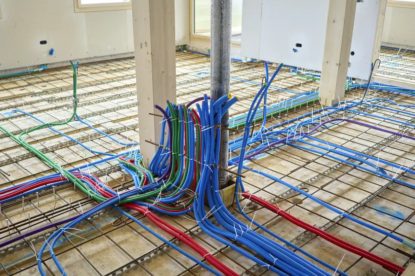 Radiant floor heating loops laid out before the concrete pour