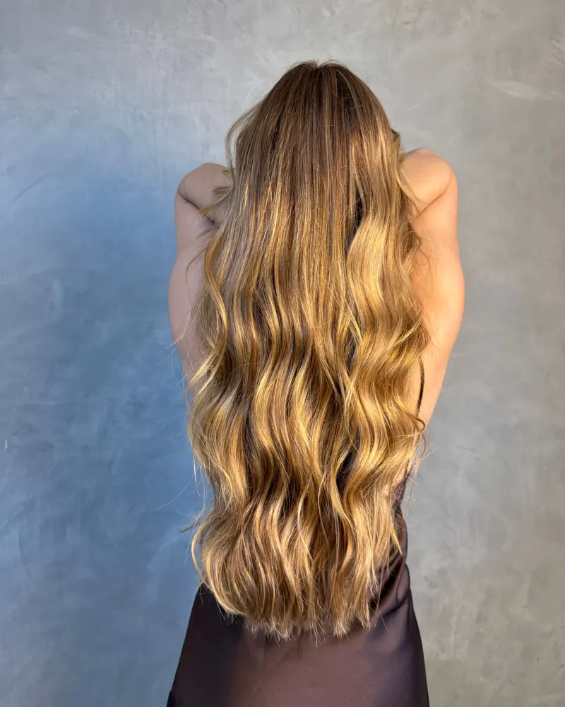 Very long honey blonde waves from behind