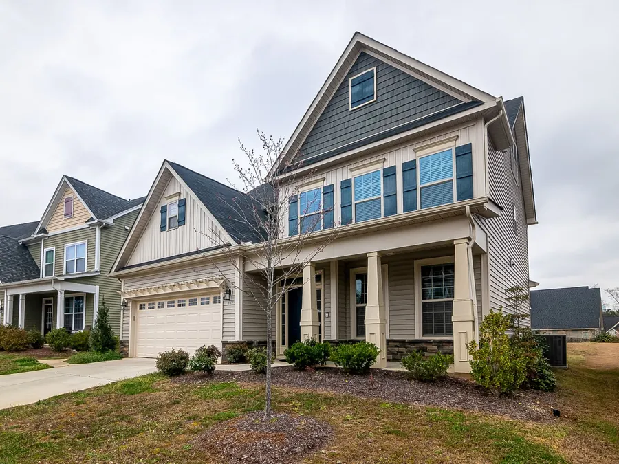 Suburban home with a new gray shingle roof