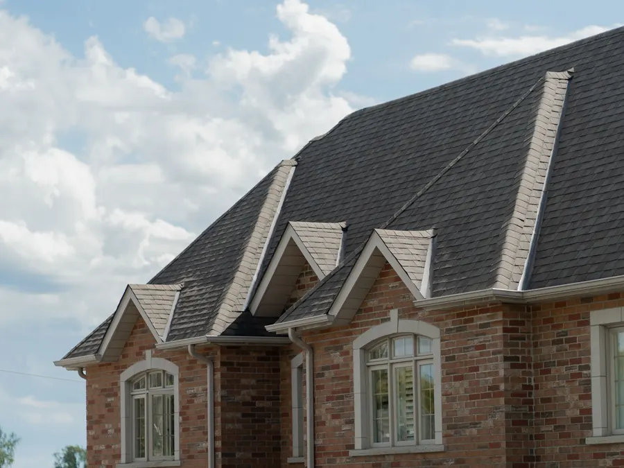 Large brick home with a steep new roof